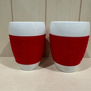 2 Bodum Pavina porcelain mugs with red silicone sleeve